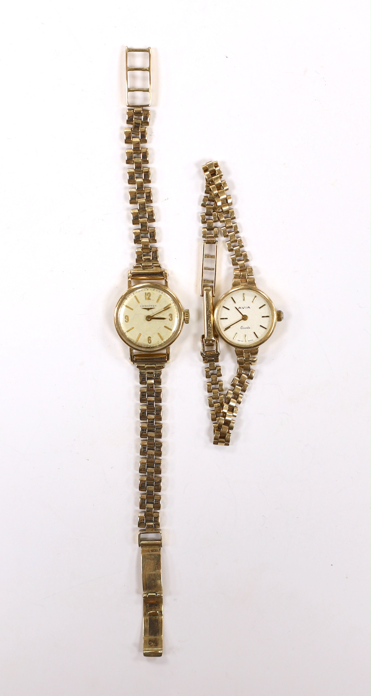 A lady's 9ct gold Longines manual wind wrist watch, on a 9ct gold bracelet and a similar Avia quartz wrist watch, gross weight 34.1 grams.